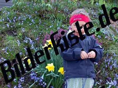 Child infront of flowers