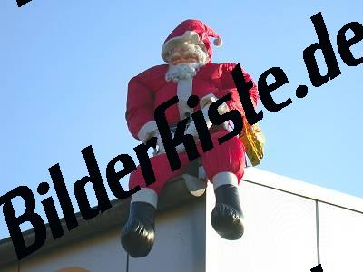 Santa Claus sitting on the roof