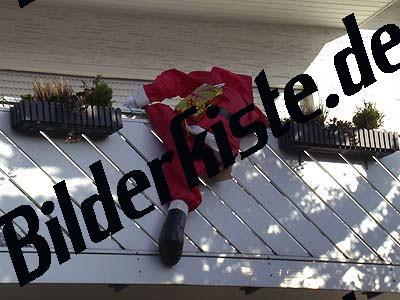 Santa Claus puppet climbing up balcony