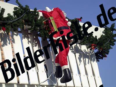 Santa Claus hanging at the balcony