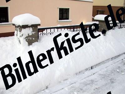 Fence covered with snow