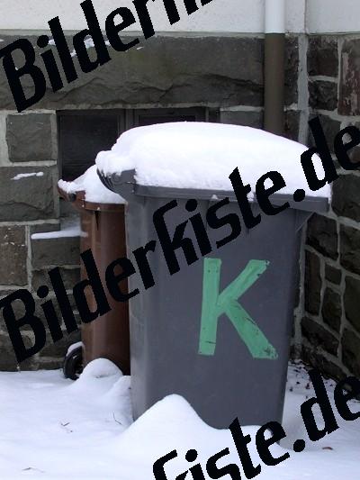 Dustbin covered with snow