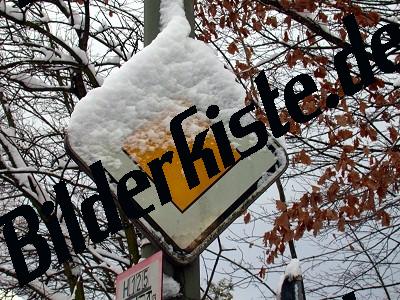 Traffic sign covered with snow