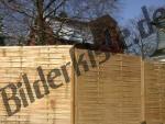 Wooden fence infront of a house