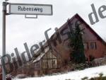 Strassenschild und Haus