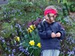 Child infront of flowers