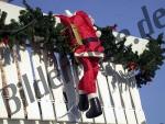 Babbo Natale che sale dal balcone