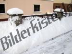 Fence covered with snow