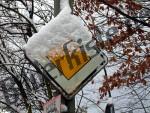 Traffic sign covered with snow