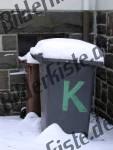 Dustbin covered with snow