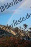 Rainbow behind a mountain